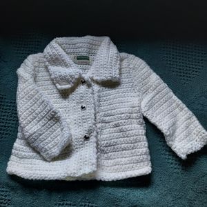Hand crocheted baby sweater